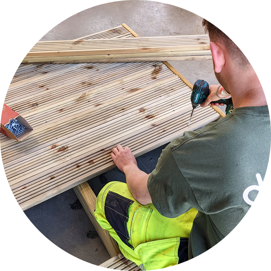 a man assembling timber play equipment 